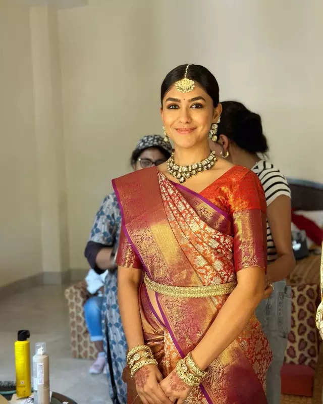 Mrunal Thakur looks radiant in a timeless red saree, sets ethnic style bar high in stunning pictures