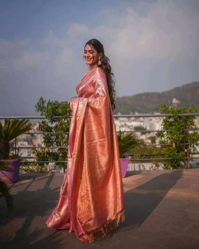 Mrunal Thakur looks radiant in a timeless red saree, sets ethnic style bar high in stunning pictures