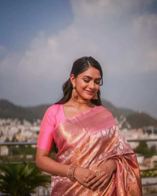 Mrunal Thakur looks radiant in a timeless red saree, sets ethnic style bar high in stunning pictures