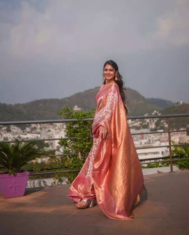 Mrunal Thakur looks radiant in a timeless red saree, sets ethnic style bar high in stunning pictures