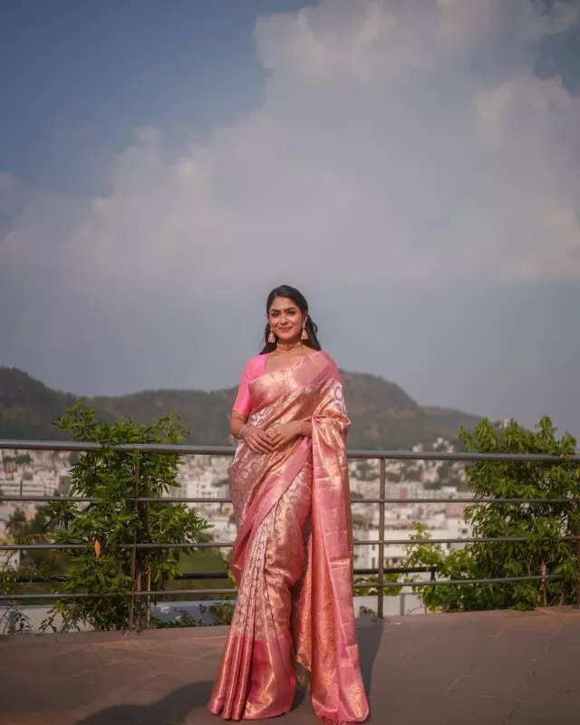 Mrunal Thakur looks radiant in a timeless red saree, sets ethnic style bar high in stunning pictures