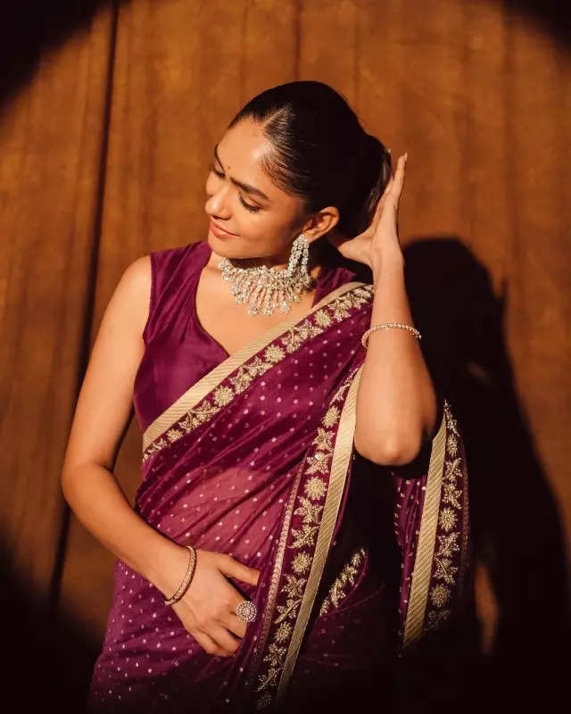 Mrunal Thakur looks radiant in a timeless red saree, sets ethnic style bar high in stunning pictures