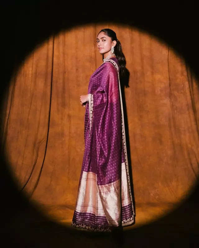 Mrunal Thakur looks radiant in a timeless red saree, sets ethnic style bar high in stunning pictures