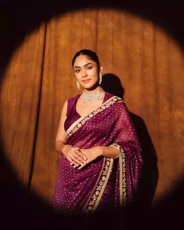 Mrunal Thakur looks radiant in a timeless red saree, sets ethnic style bar high in stunning pictures