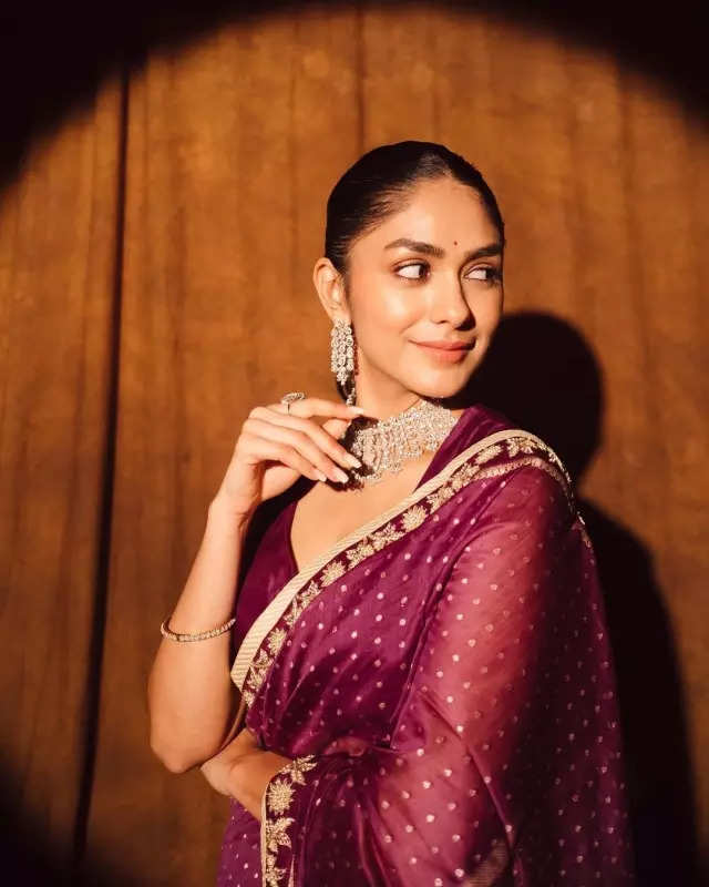 Mrunal Thakur looks radiant in a timeless red saree, sets ethnic style bar high in stunning pictures