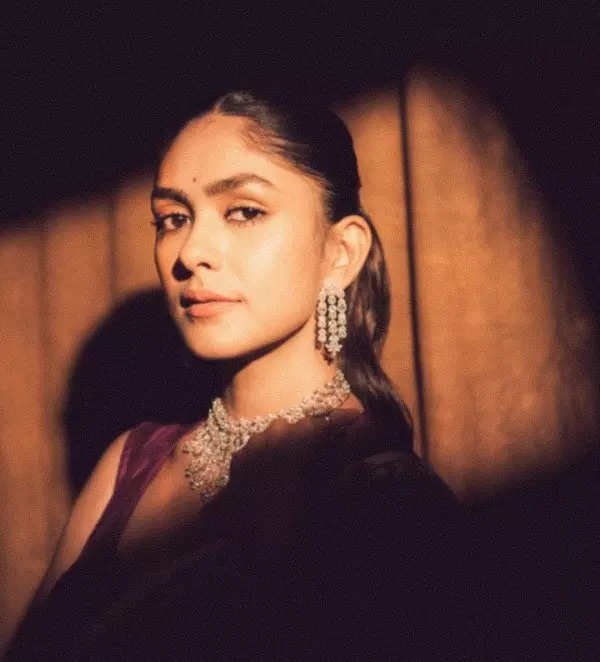 Mrunal Thakur looks radiant in a timeless red saree, sets ethnic style bar high in stunning pictures