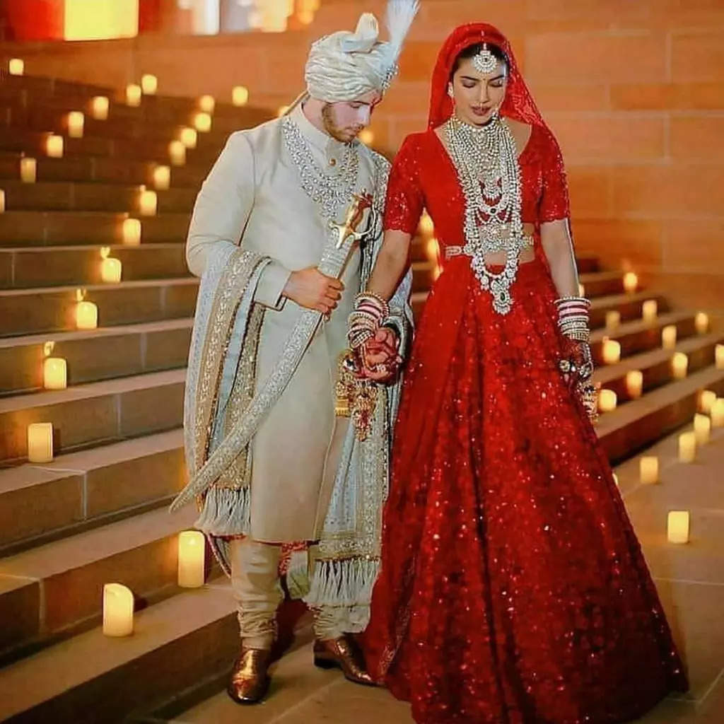 Neha Kakkar's Reception Lehenga Looks Inspired By Priyanka Chopra; Red  Lehenga And See Through Veil Will Remind You Of Chopra's Lavish Wedding
