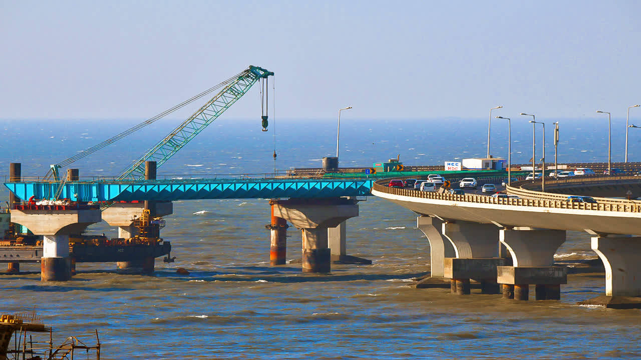 Coastal Road girders being placed via barges