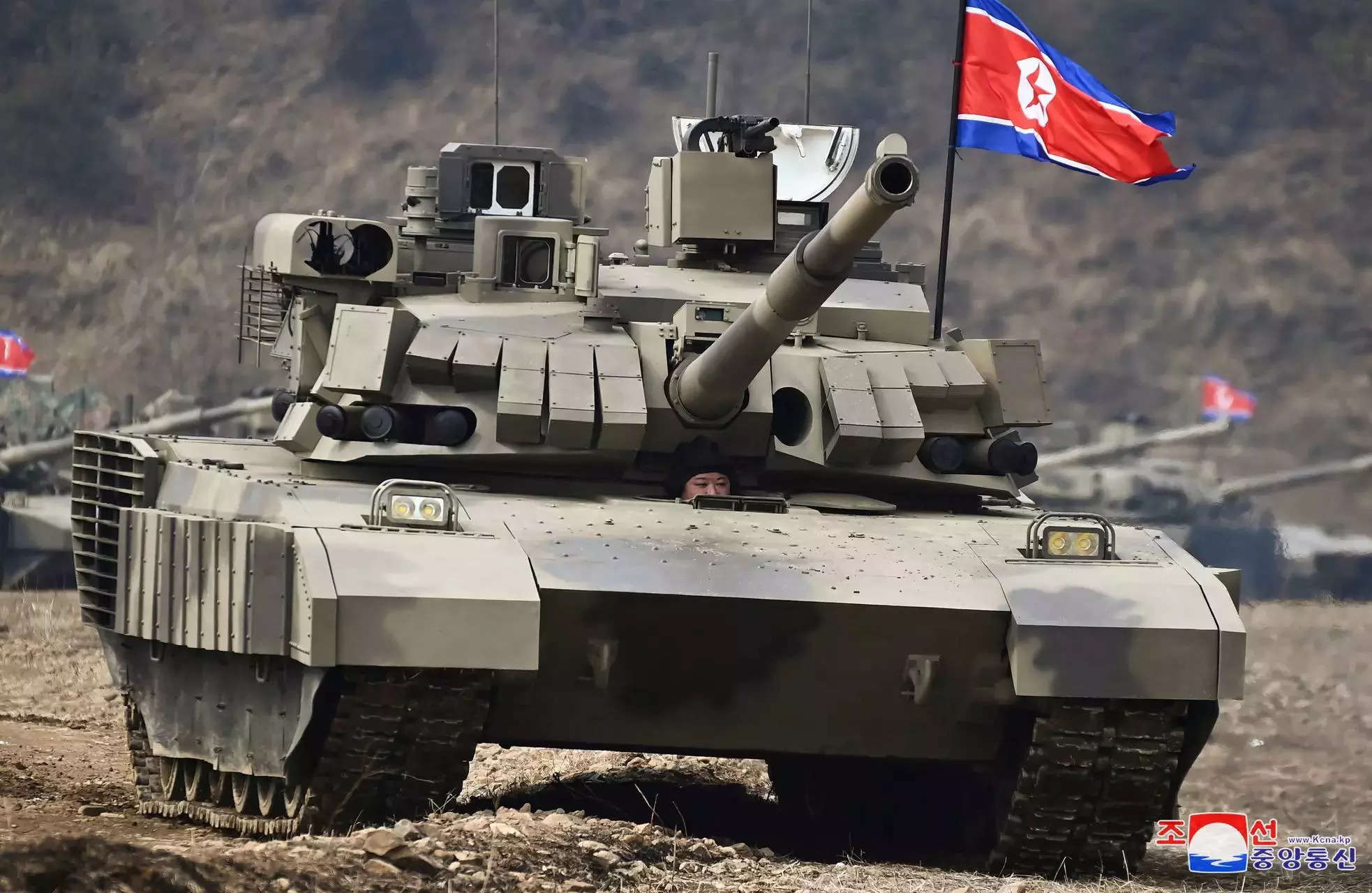 Kim Jong-un drives new tank in military drill