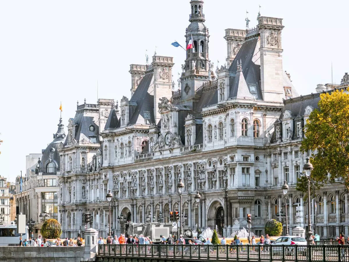 French police removes migrants staying near the iconic Paris City Hall ahead of Olympics
