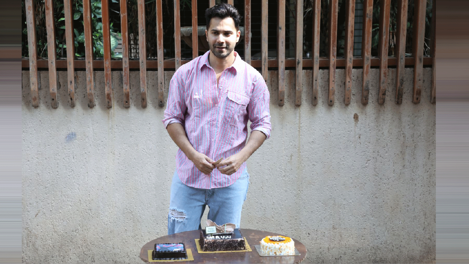 Varun Dhawan cuts a cake on his birthday