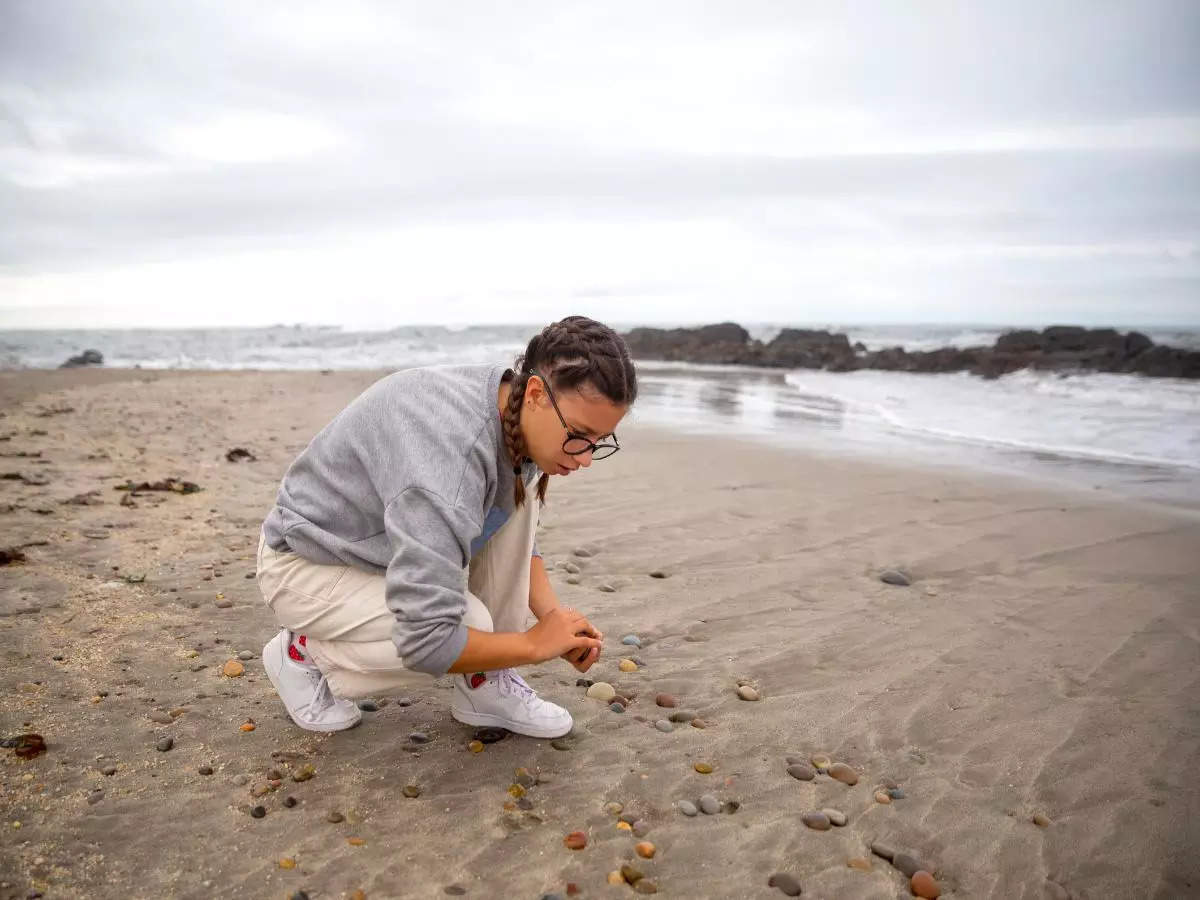 Why is collecting beach pebbles not a wise thing to do?