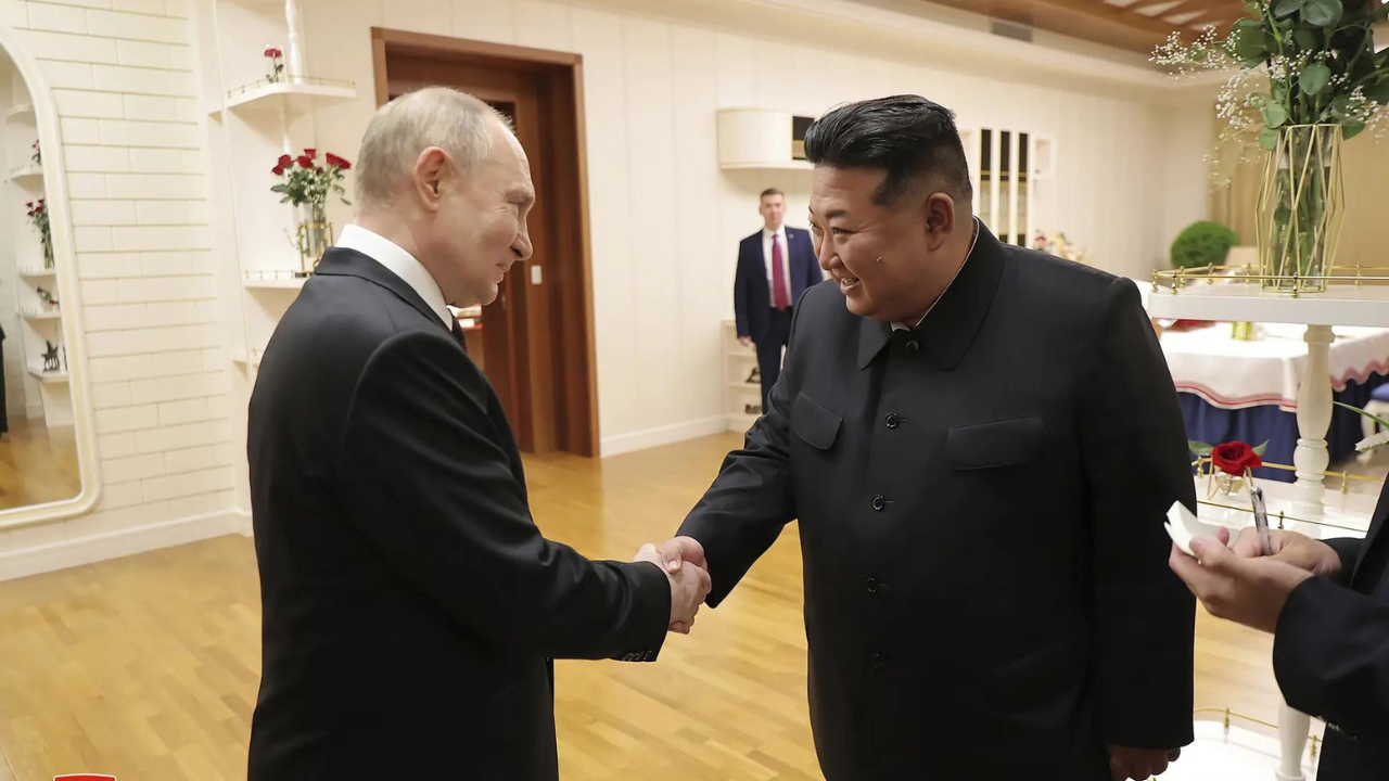 Vladimir Putin embraced with smiles, handshakes, and hugs from Kim Jong ...