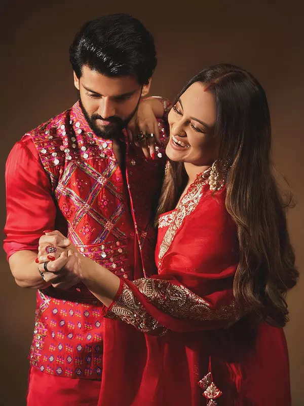 Sonakshi and Zaheer Dazzle in matching red outfits, perfectly coordinating their festive look