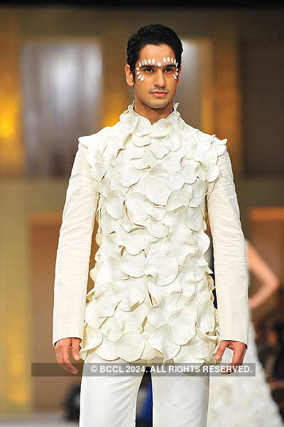 A model showcases a creation by designer Rohit Bal during the grand ...