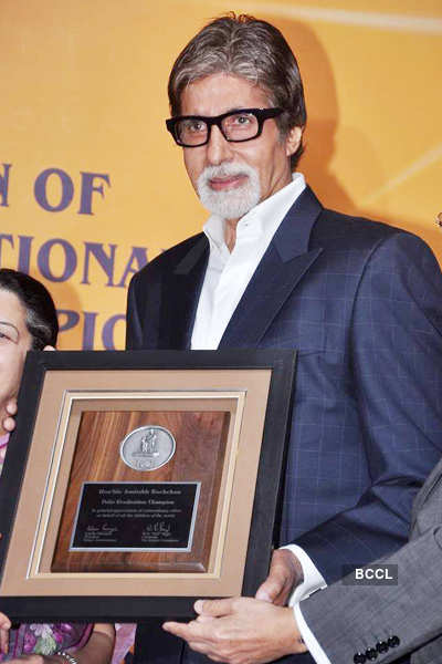 Amitabh Bachchan (R) Holds A Plaque While Rajashree Birla, Director Of ...