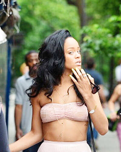 Rihanna goes braless, flashes nipples!