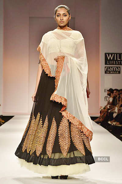 A model showcases a creation by designer Joy Mitra on Day 5 of the ...