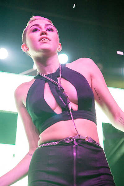 Miley Cyrus dances with stripper