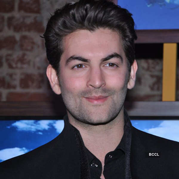 Neil launches coffee table book