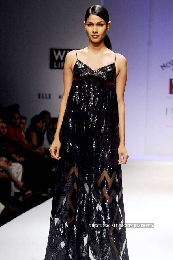 A model showcases a creation by designer Pallavi Mohan on Day 2 of the ...