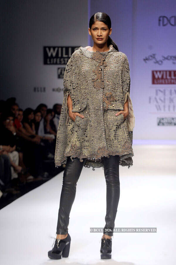 A model showcases a creation by designer Pallavi Mohan on Day 2 of the ...