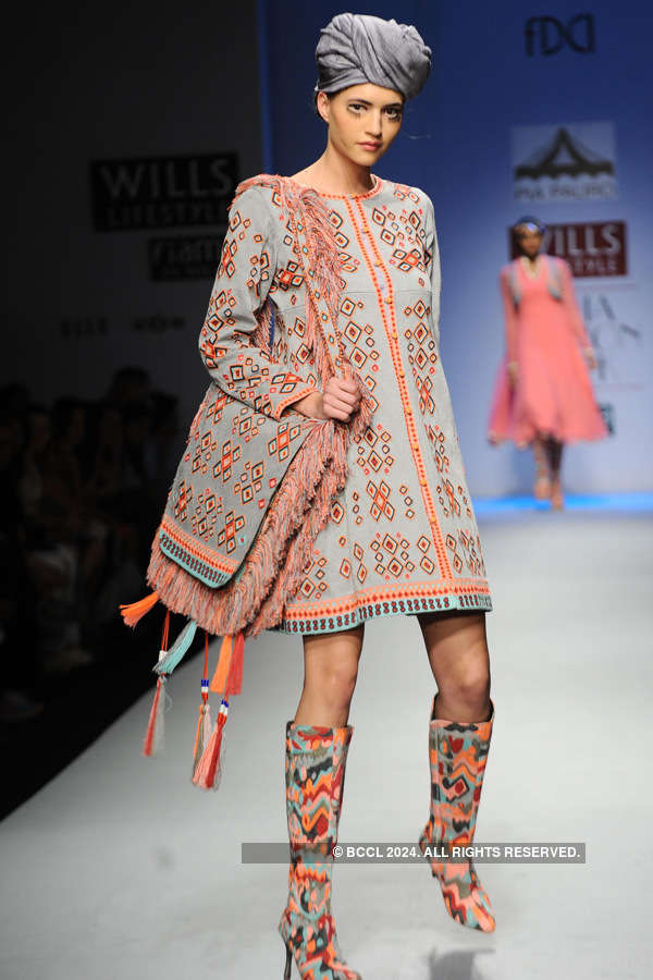 A model walks the ramp for designer Pia Pauro on Day 4 of the Wills ...