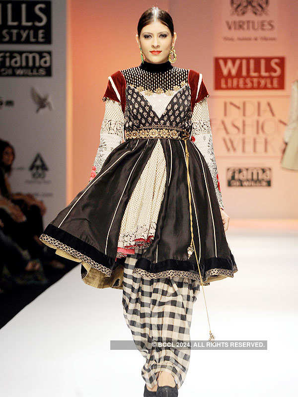 A model showcases a creation by fashion designers Ashish and Vikrant on ...