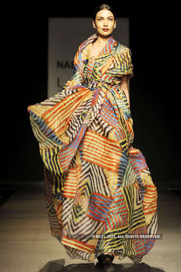A model showcases a creation by designer Naeem Khan at Lakme Fashion ...