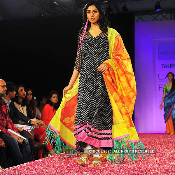 A model showcases a creation by designer Swati Vijayaraje on Day 5 of ...