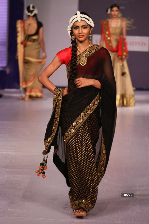 Models showcase a creation by designer Sulakshana Monga during a ...