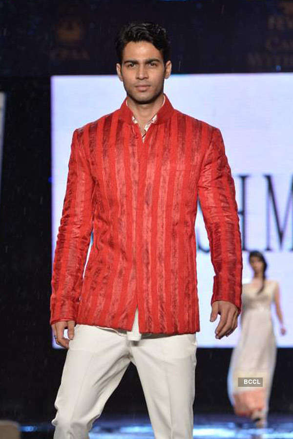 A model showcases a creation by designer Manish Malhotra during the 8th ...