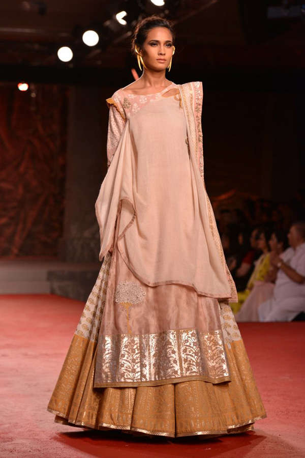 A model showcases a creation by designer Anju Modi on Day 1 of Delhi ...