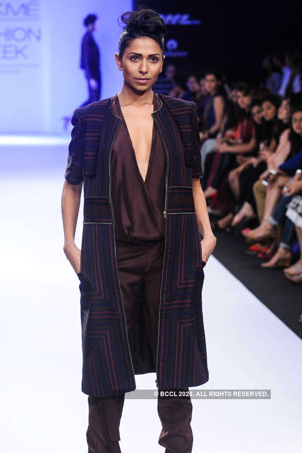 A model showcases a creation by designer Nupur Kanoi on Day 4 of the ...