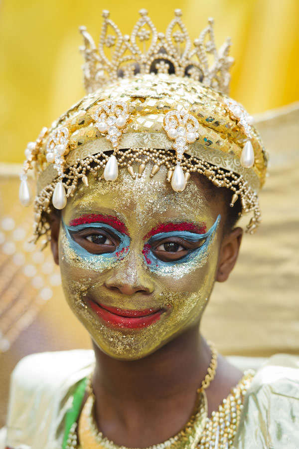 A girl smiles as she prepares to take part in the parade on the first ...