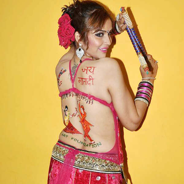Actress Tanisha Singh gets into the festive mood by painting her back with  garba tattoo, in Mumbai, on October 6, 2013.