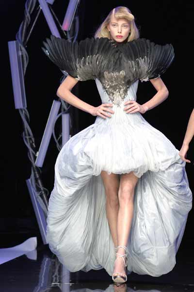 A model flaunts a creation by British fashion designer Alexander ...