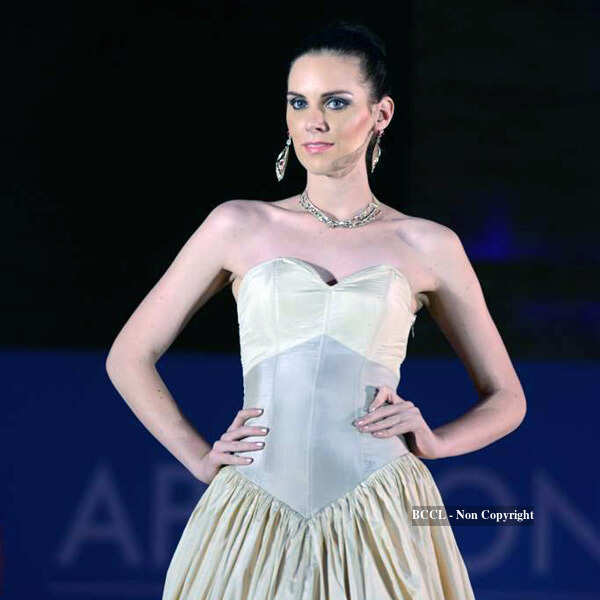 A model walks the ramp for the jewellery brand Zoya during APSICON 2013 ...