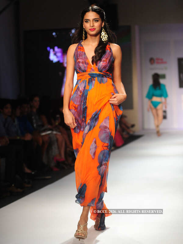 A model showcases a creation by designer label Turquoise and Gold ...