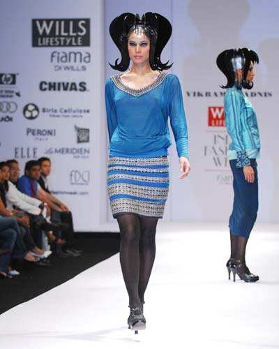 Neha Kapur displays an outfit from designer Vikram Phadnis' fall/winter