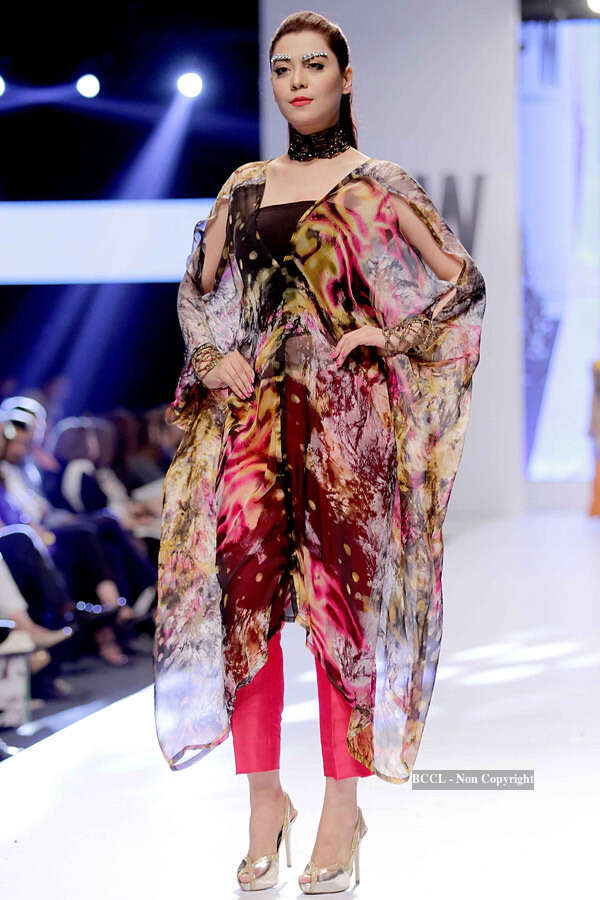 A Pakistani model presents a creation by designer Adnan Perdesi during ...