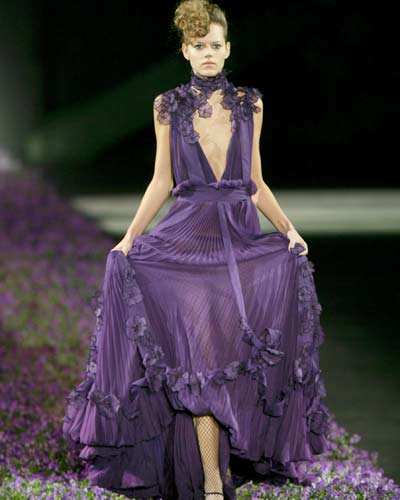 Top French model Laetitia Casta, for French fashion designer Yves Saint
