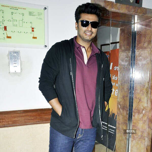 Alia Bhatt helps Arjun Kapoor with his hairstyle during the promotion of  movie 2 States, held at Radio City, on March 27,