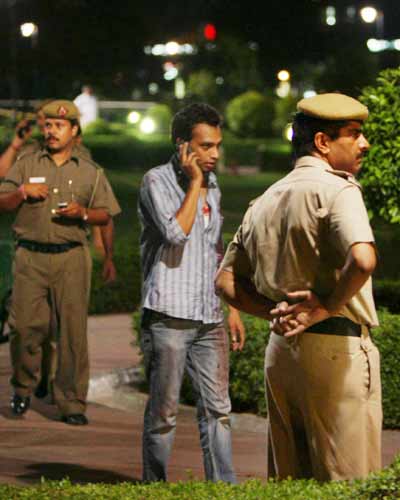 Policemen Stand Near The Site Of One Of The Bomb Blasts In New Delhi ...