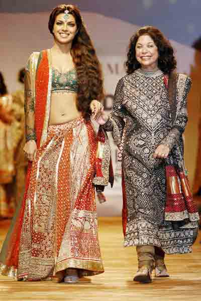She's the creator: Priyanka Chopra (L) displays a creation by designer ...