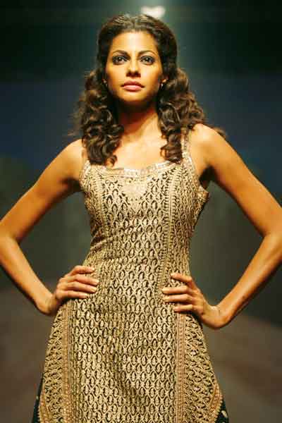 She's the creator: Priyanka Chopra (L) displays a creation by designer ...