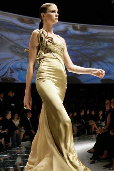 model presents a creation for Italian fashion house Versace as part of ...