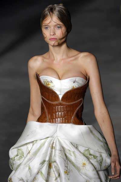 A model presents a creation by British fashion designer Alexander