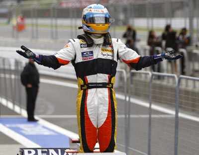 Renault Formula One driver Fernando Alonso of Spain celebrates 