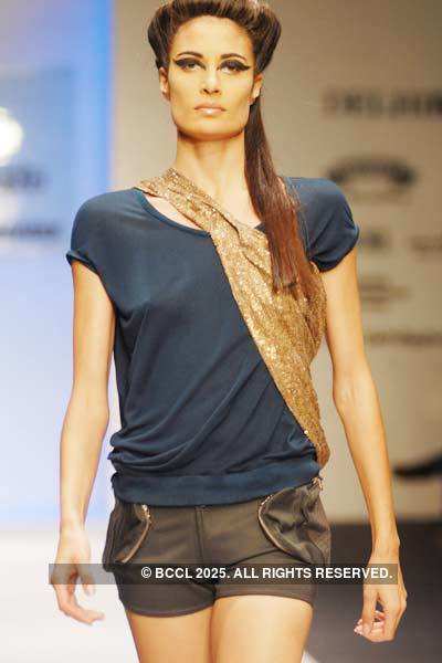 Nina Manuel displays a creation by designer Gaurav Gupta during Delhi ...